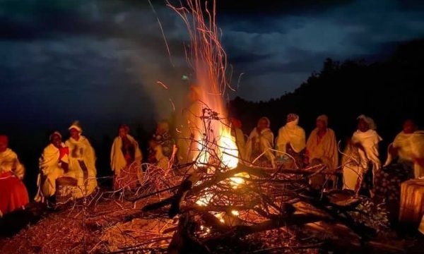 Magical moment of dorze tribe singing and dancing around a fire up a mountain in Ethiopia